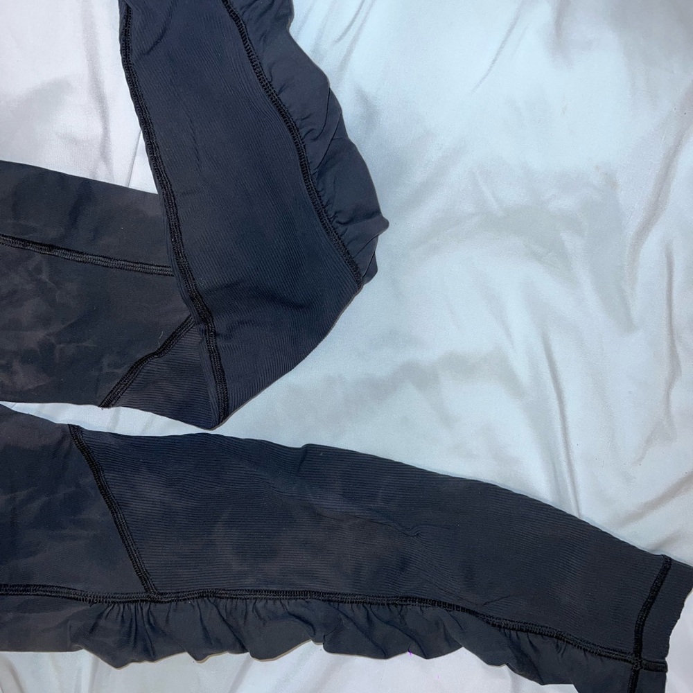 Lululemon Navy blue & grey stripped Ruffled Leggings with zipper on back side.
